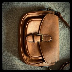 Small brown cross body purse.